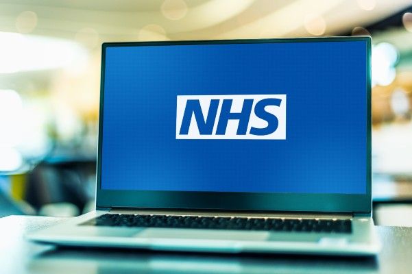 The NHS logo on a laptop screen